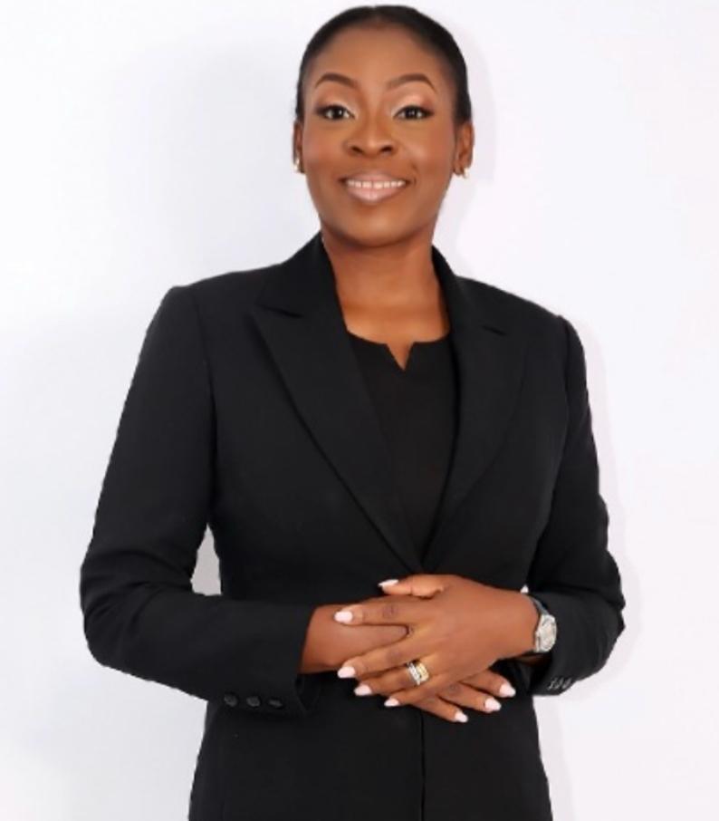 Victoria, founder and CEO of Victoria Book Resources, wearing a black suit